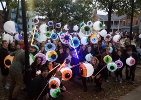 kids holding eyeball art